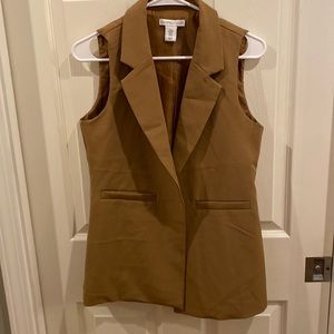 Sleeveless tan blazer